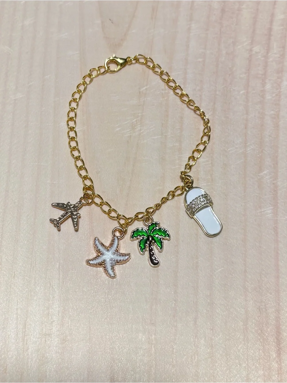 Gold-Tone Beach Charm Bracelet with White and Green Accents